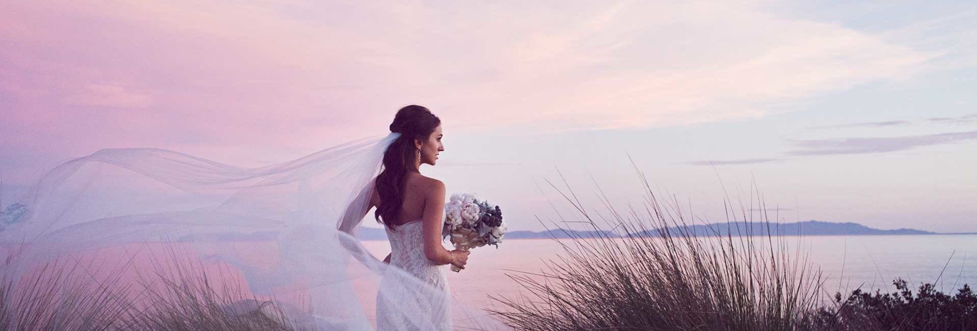 A Bride in her Wedding Dress with A Coastal View