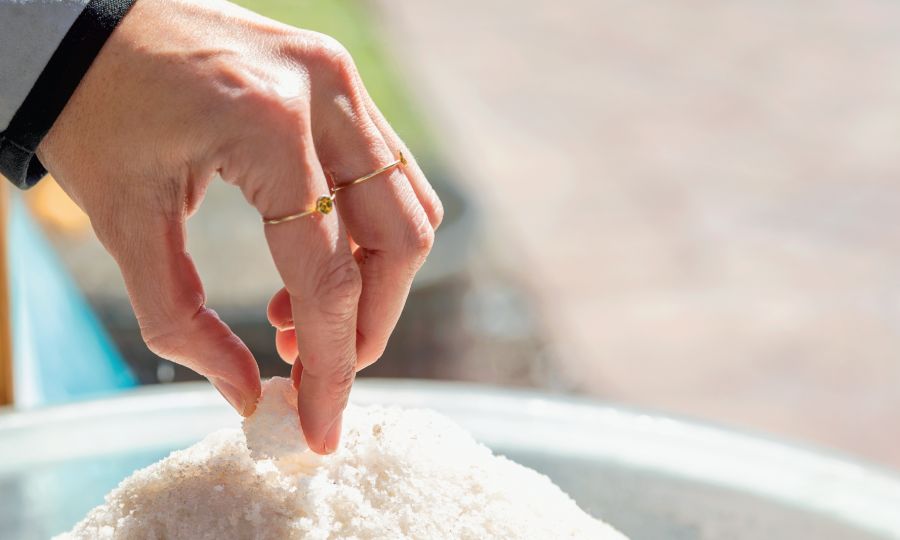 A Hand Holding Sea Salt